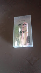 Close-up of multi-pin plastic wall hooks for secure hanging without drilling