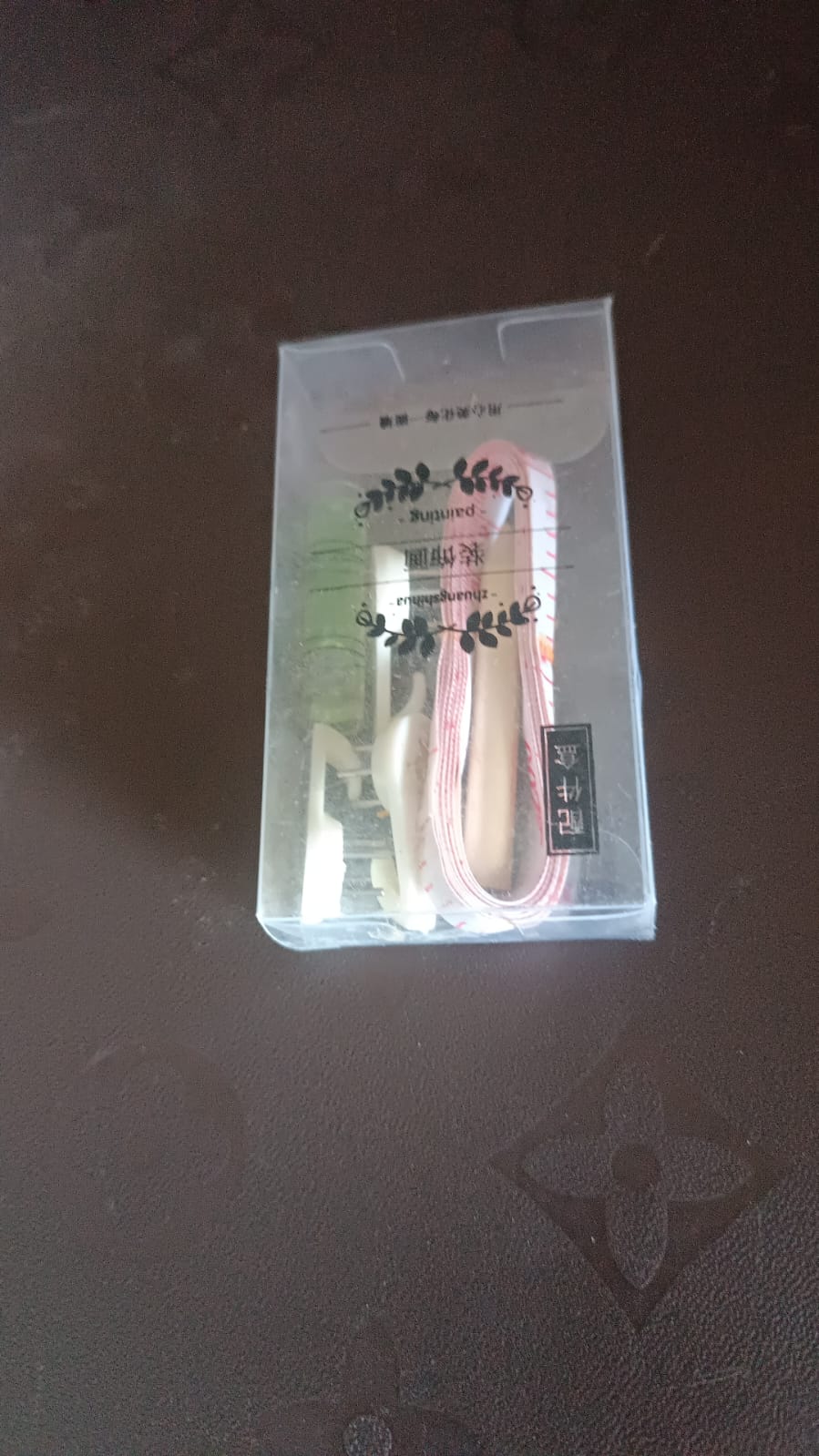 Close-up of multi-pin plastic wall hooks for secure hanging without drilling