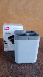 Standing desk organizer with multiple sections saving workspace