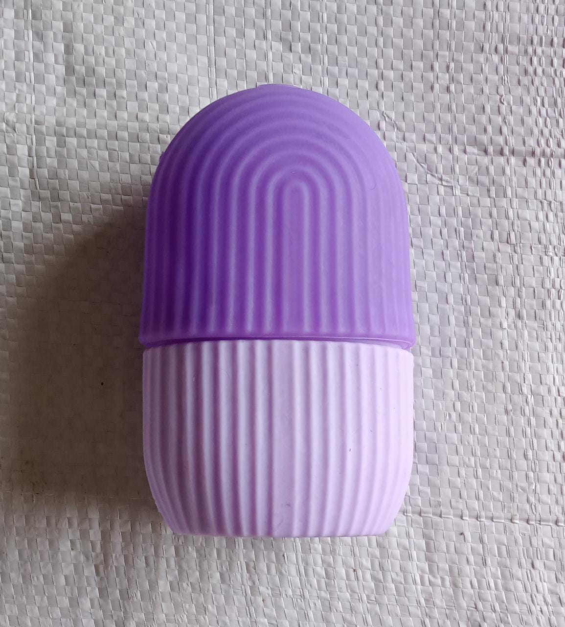 Packaging for the GlowForm purple ice roller, ready for gifting or delivery.
