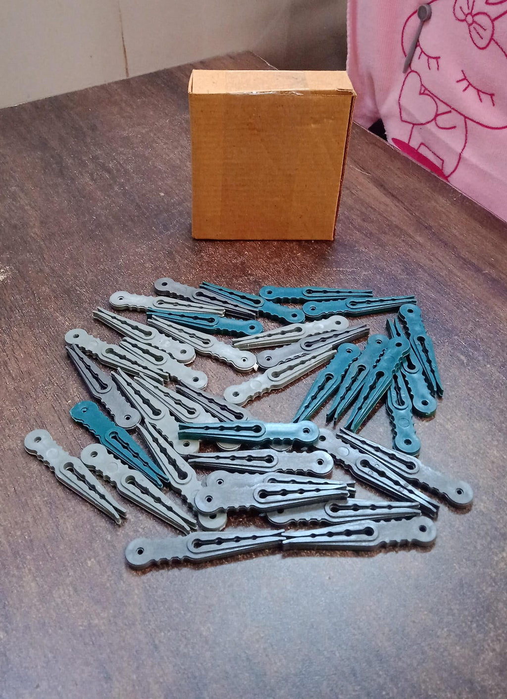 An image illustrating the compact size and easy storage of the 36 Pcs plastic cloth pegs.