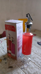 Lifestyle shot of the Vastate olive oil dispenser on a kitchen counter, ready for daily use.