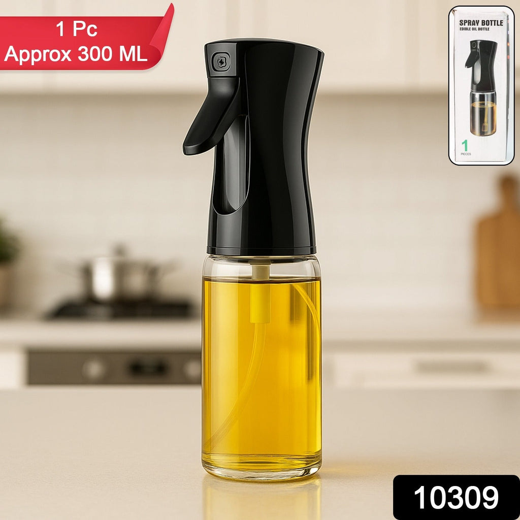 Transparent glass oil mister on a kitchen counter, ready for use.