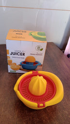 Orange Hand Press Juicer with integrated pulp basket, ensuring clean juice.