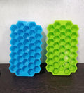 Colorful silicone ice cube tray with honeycomb design for easy release.