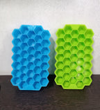 Colorful silicone ice cube tray with honeycomb design for easy release.