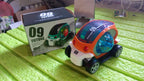 Top-down view of the red rotating stunt car toy, showcasing its compact size and design.