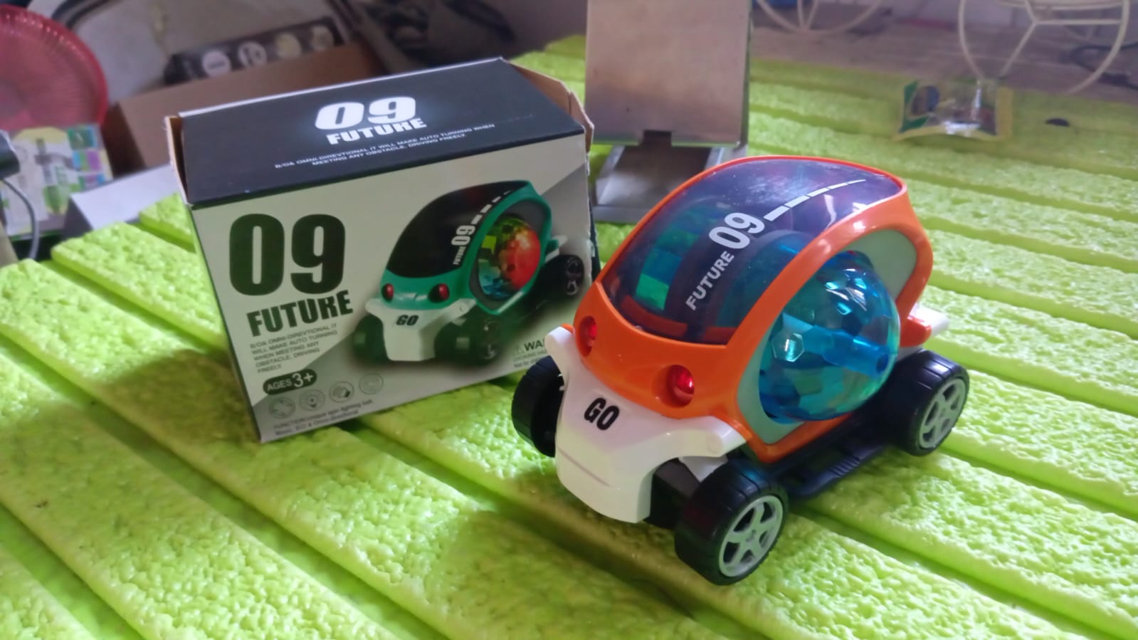 Top-down view of the red rotating stunt car toy, showcasing its compact size and design.