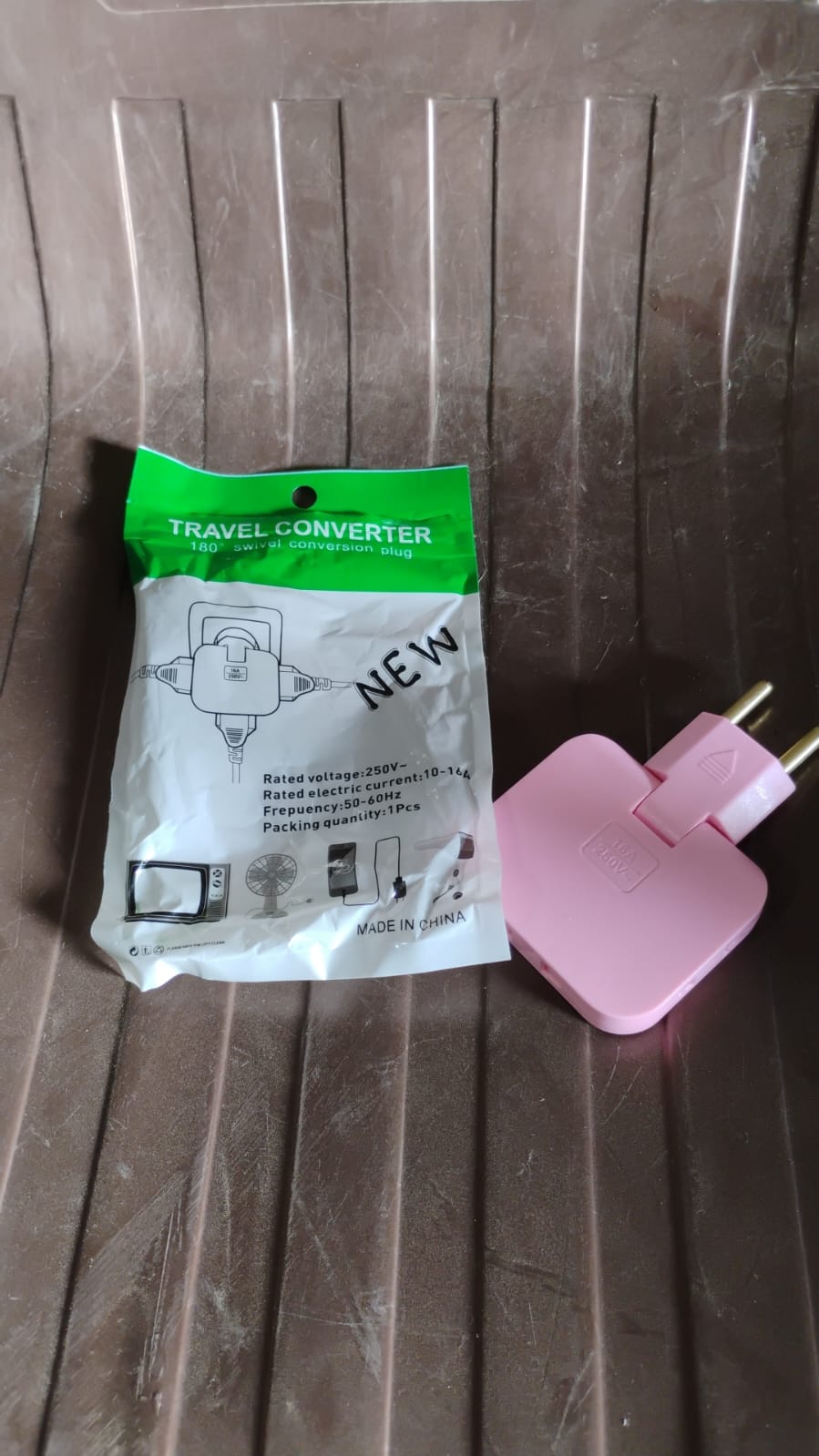 Unboxing view of the Tetherix Foldable Wall Plug Adapter, ready for use.