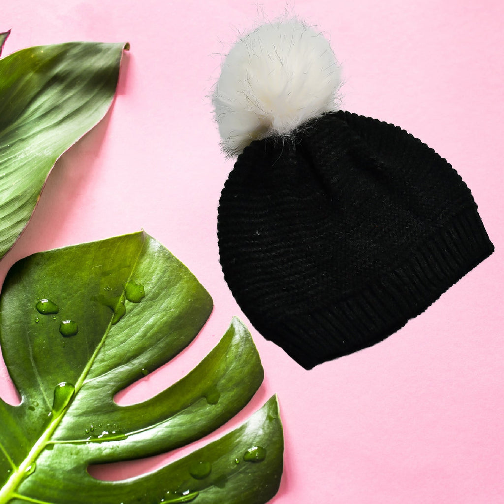 Comfortable woolen knitted beanie cap with a plush black fur interior for warmth.