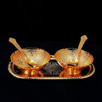 Detailed view of the elegant brass serving set, showcasing its intricate gold and silver plating.