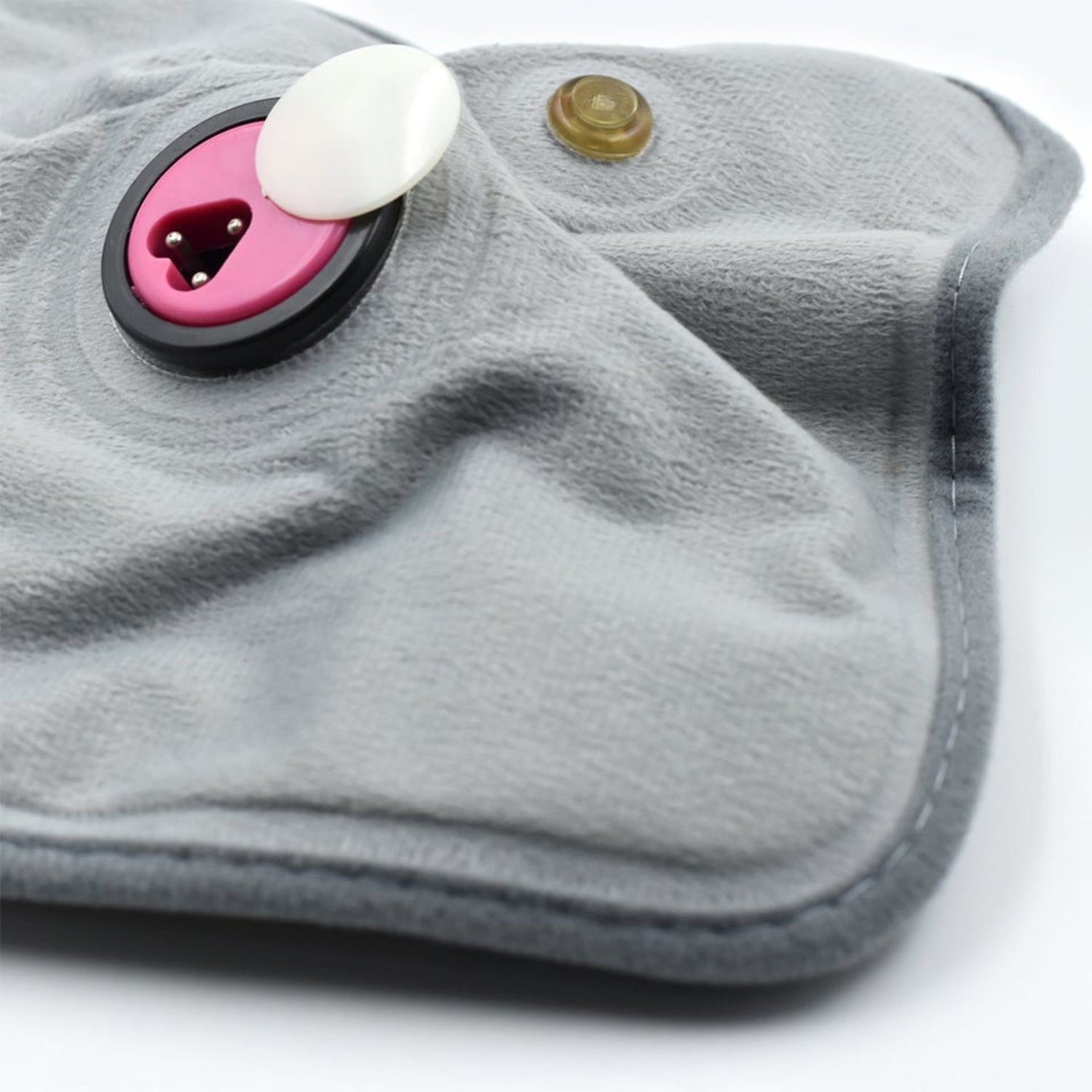 Detailed view of the electric heating pad's soft cloth material for soothing warmth.