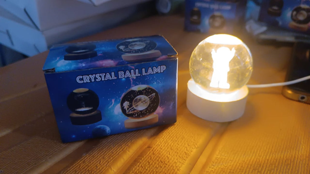 The Moon Crystal Ball Lamp glowing softly, ideal as a 3D night light for relaxation.