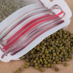 A 500ml reusable plastic pouch filled with nuts, showcasing its self-standing design.