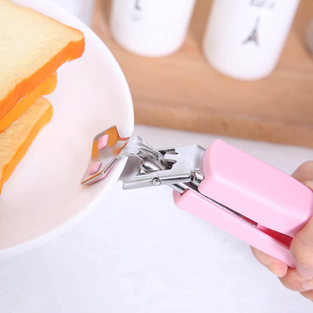 The Hot Dish Plate Clip securely lifting a hot ceramic plate, showing its reliable grip.