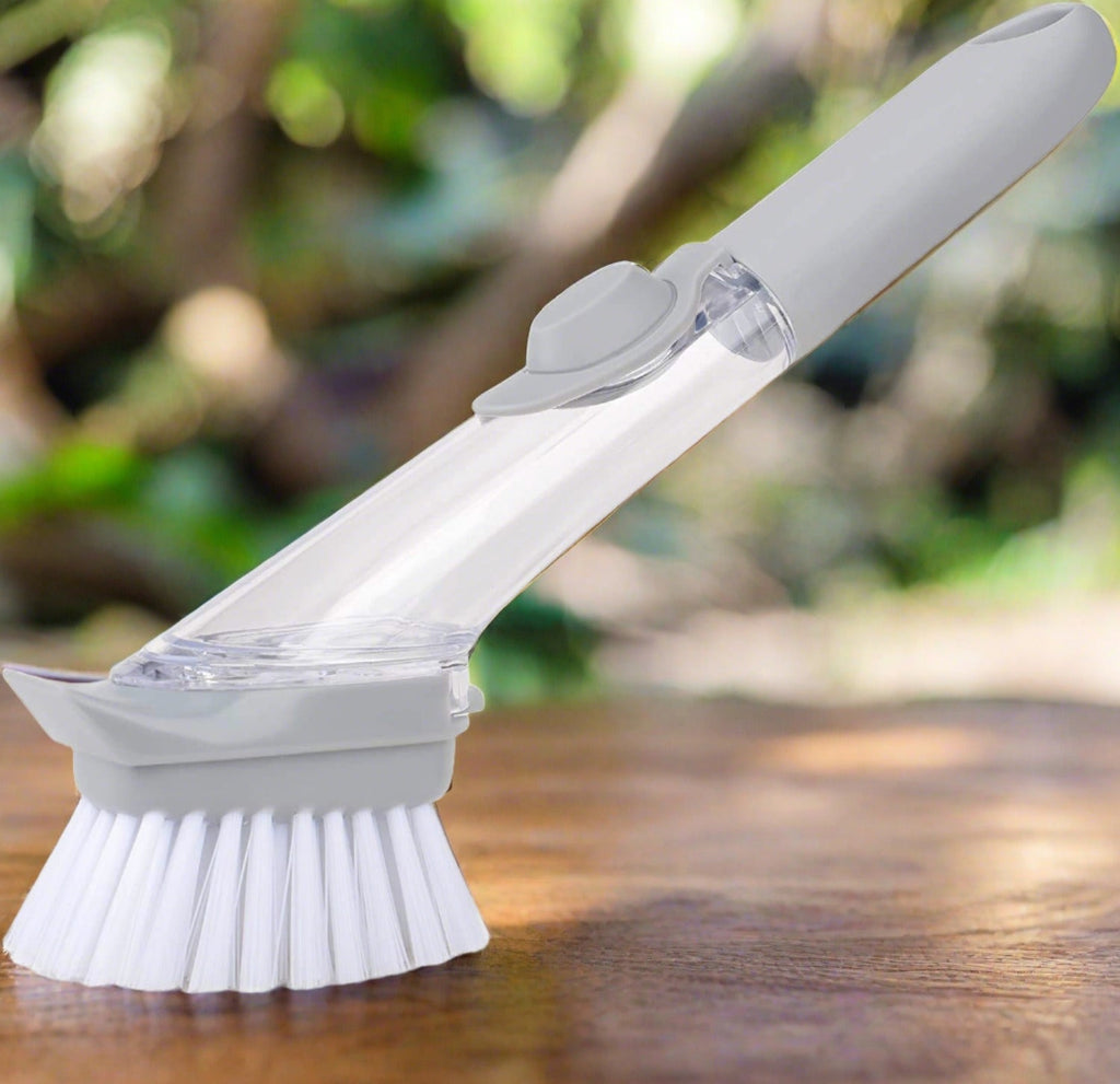 Liquid dispenser dish brush with scraper edge for effective kitchen cleaning.