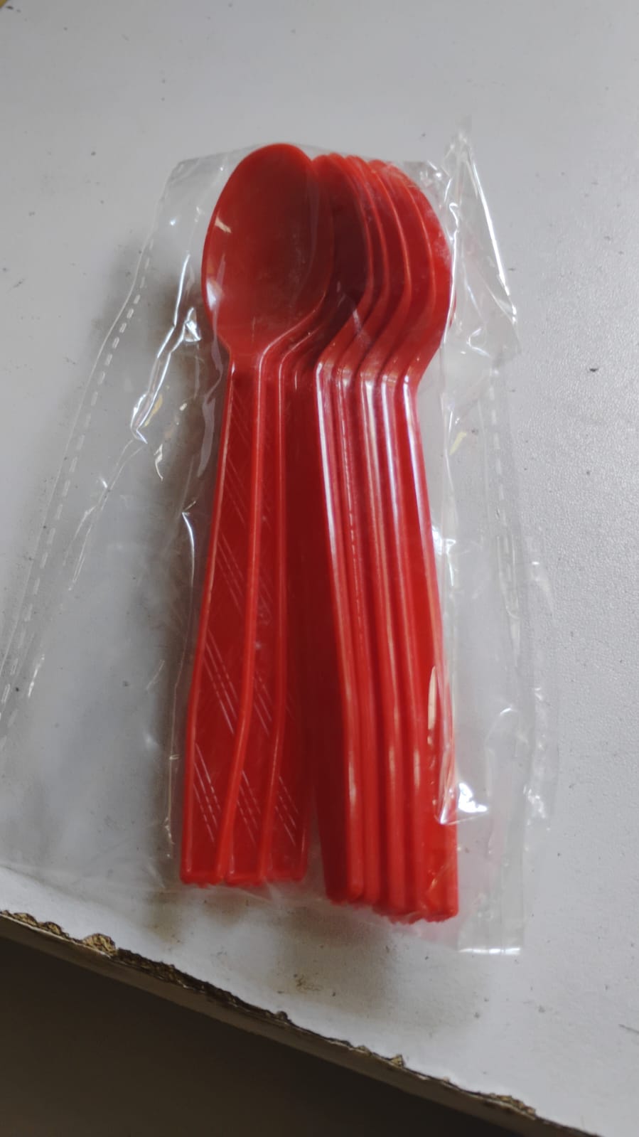 Packaged set of 8 reusable plastic spoons ready for home, parties, and outdoor use