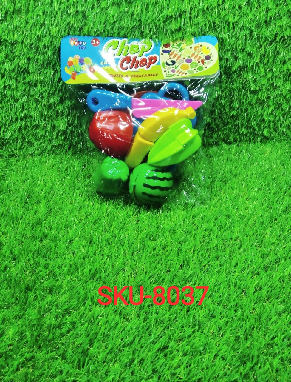 Happy child playing with the Sliceable Play Food Set, enjoying a pretend cooking activity.