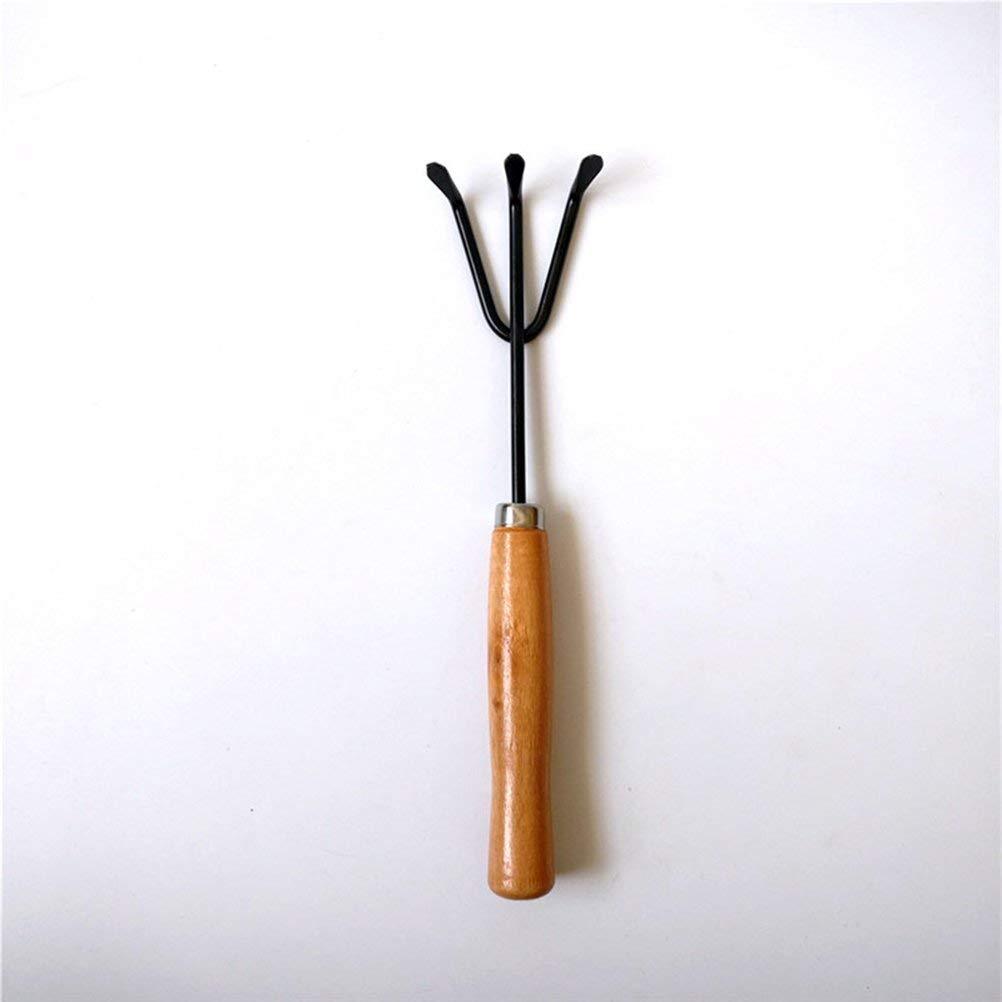 Gardener holding the hand cultivator, demonstrating comfortable grip.