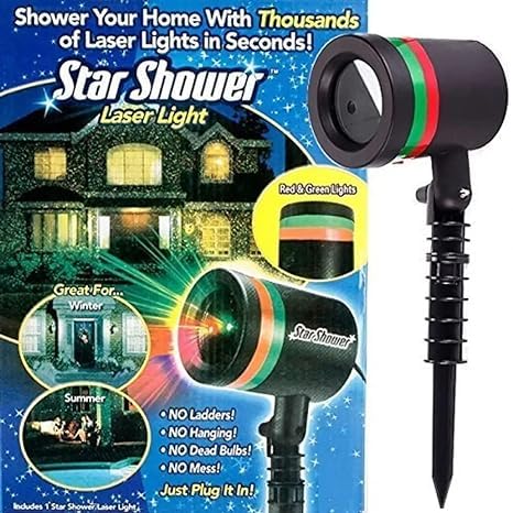 Decorative laser light patterns illuminating a garden and home exterior for celebrations.