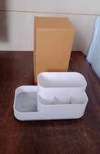 Plastic multipurpose organizer holder neatly arranged on a wooden desk.