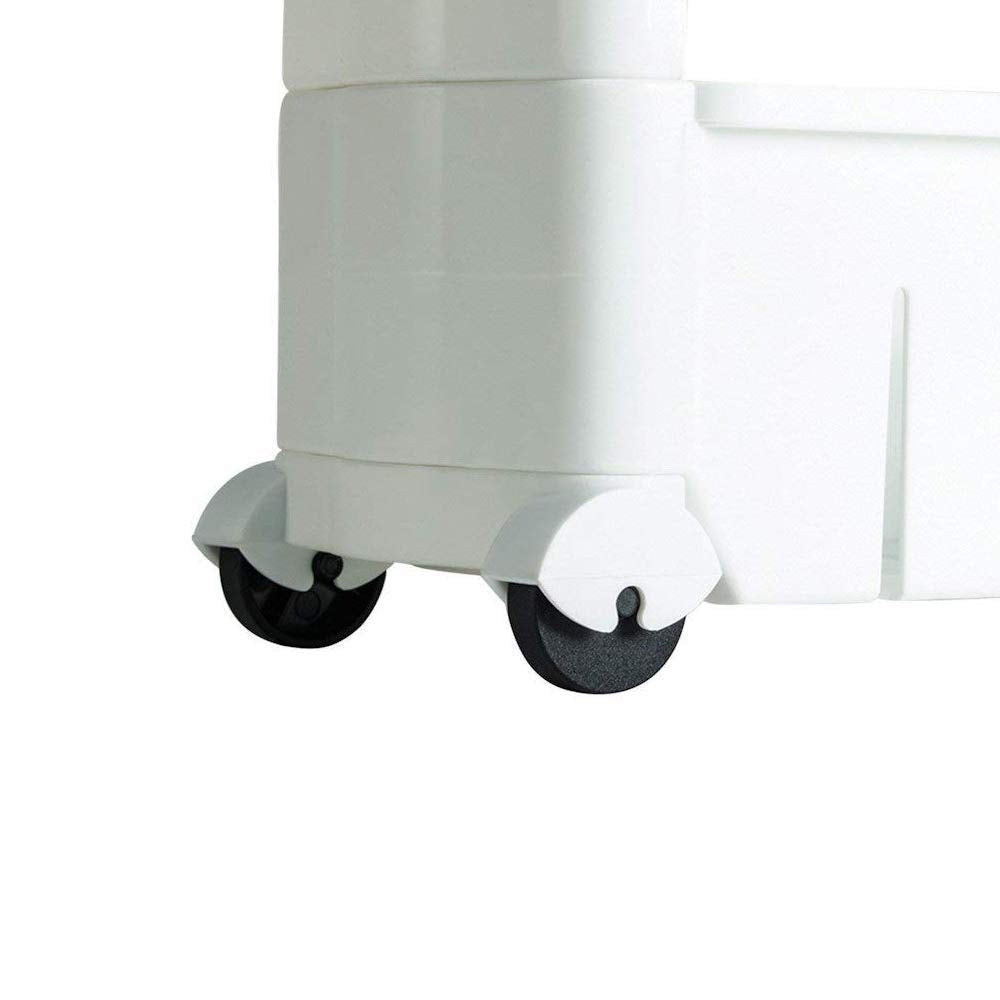 The slim storage rack positioned next to a kitchen appliance, showcasing its discreet fit.