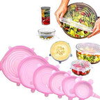 Set of clear silicone stretch lids covering various food containers.