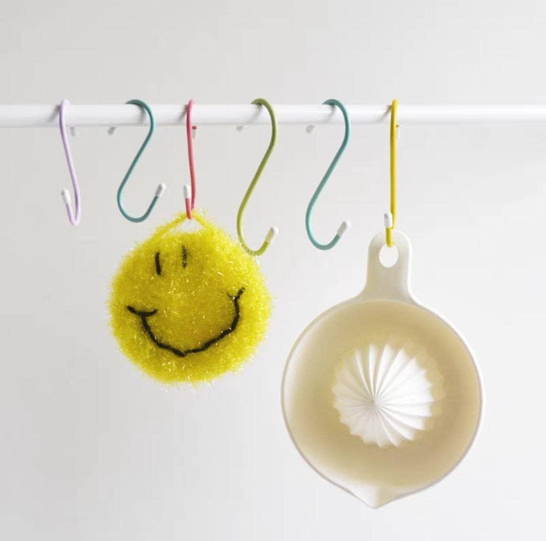 Heavy-duty S hooks metal holding frying pans and kitchen tools on a hanging rack.