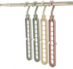 Innovative magic wardrobe hanger with an anti-skid surface holding various clothing items.
