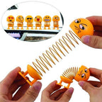 Multiple angles of the smiling face shaking head doll, highlighting its expressive features.