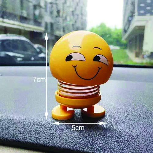 Angled view of an emoticon spring figure with a cheerful smiling face on a white background.