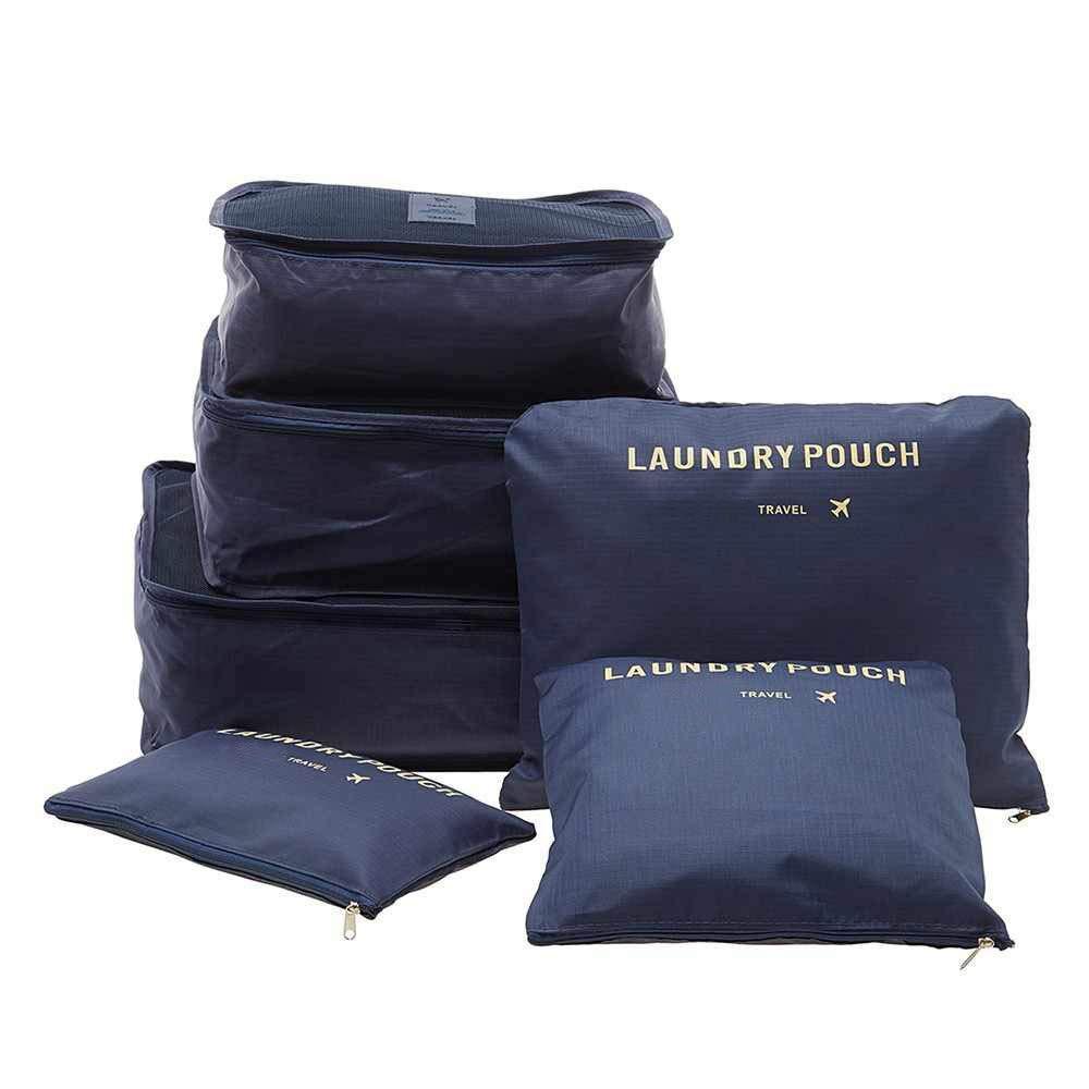 Clothes neatly folded and packed into various sizes of travel packing cubes.