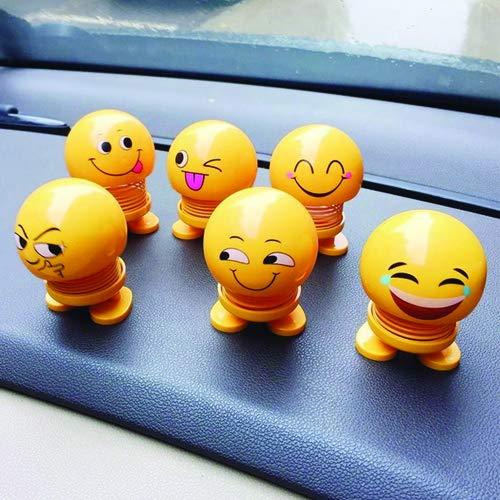 Side profile of an emoticon figure shaking head doll, ideal as a car dashboard ornament.