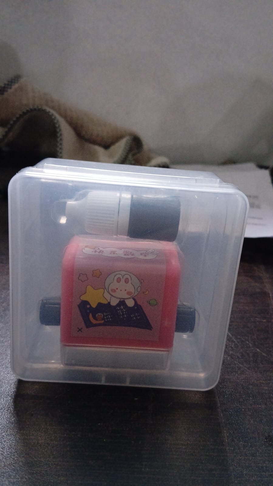 Portable addition and subtraction roller stamp for on-the-go math practice.