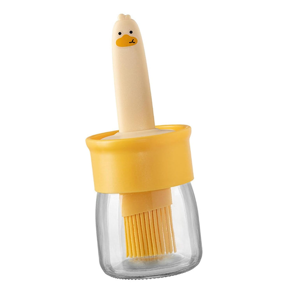 A side view of the transparent oil dispenser bottle, emphasizing its sleek kitchen design.