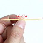 Several clean, durable wooden toothpicks fanned out, showcasing their smooth finish.