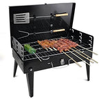Compact charcoal grill set up for an outdoor picnic, perfect for small gatherings.