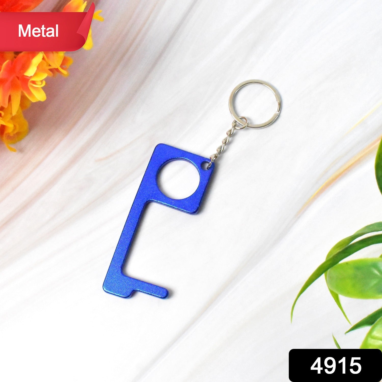 Close-up view of ergonomic Safe Touch Tool metal door opener keychain