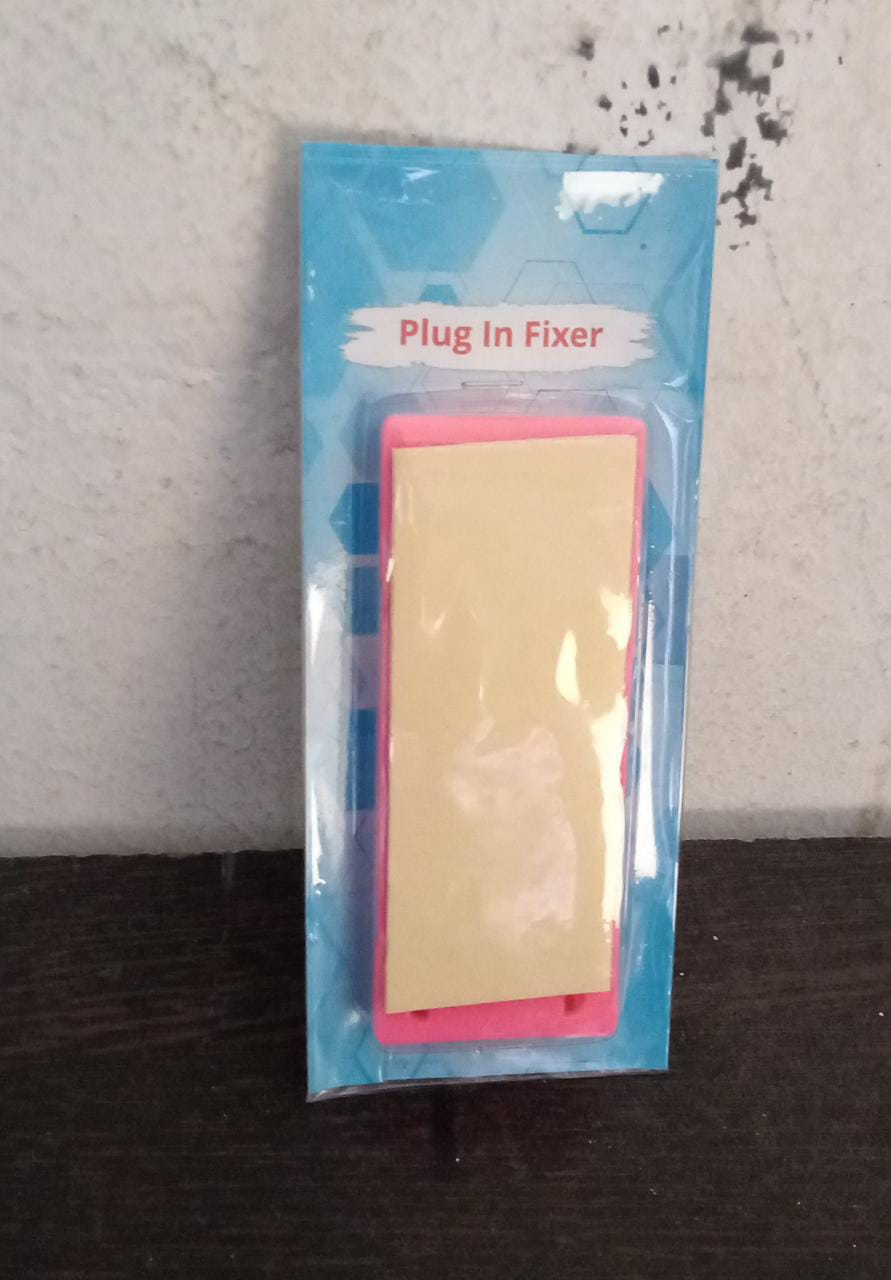 Side view of the durable Self Adhesive Plug Organizer supporting a power adapter on a wall.