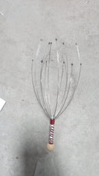 The compact handheld scalp massager, ideal for gifting for health and wellness.