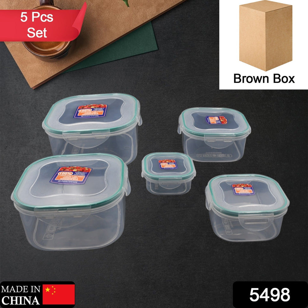 A 5-piece set of clear plastic kitchen storage containers with blue lids.