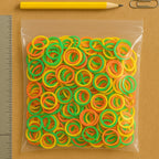 Assorted elastic rubber bands, ideal for organizing kitchen and school supplies.