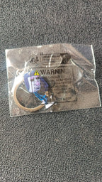 Cartoon character keychain hanging as bag accessory