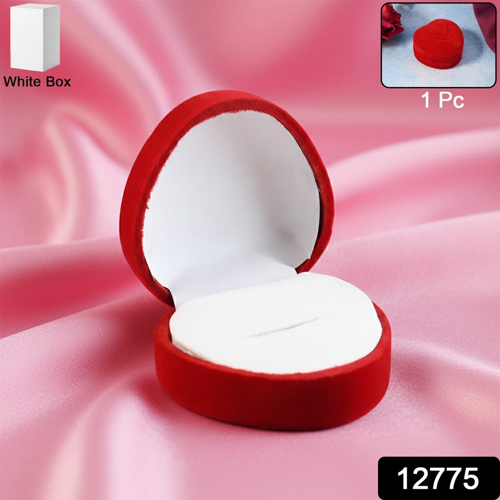 Open velvet ring box showing smooth white cushioned interior holding ring securely