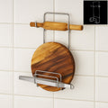 Stainless steel chakla belan chimta stand holding a rolling pin and tongs, showcasing kitchen organization.