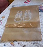 Organivo waterproof shoe bag securely holding sneakers, preventing dirt and moisture transfer.