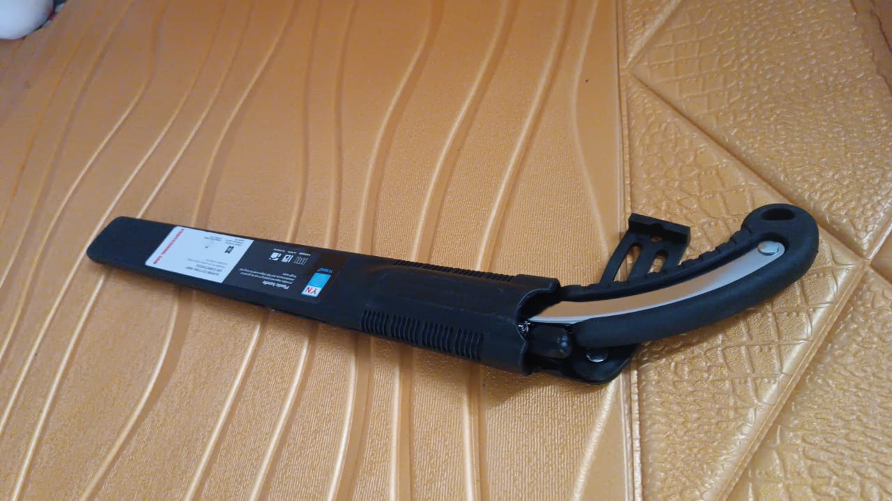 Durable hand pruning saw from Tidy Roots, essential for garden maintenance.