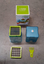 Lifestyle shot of a kitchen counter with fresh potatoes and the potato chipper ready for use.