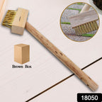 Close-up of the sturdy wire bristles on the wooden block paving brush.