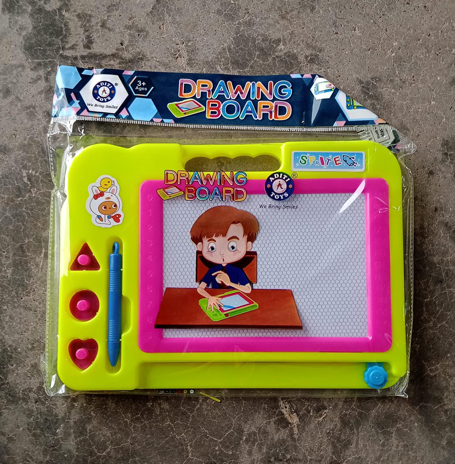 Clean, empty Aditi Magnetic Drawing Board with magnetic pen, ready for drawing.